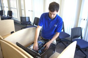 A dbSys technician working on equipment